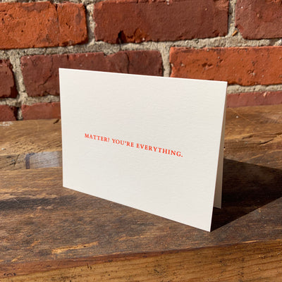Greeting card on wood table by beknown. Matter? You're everything.