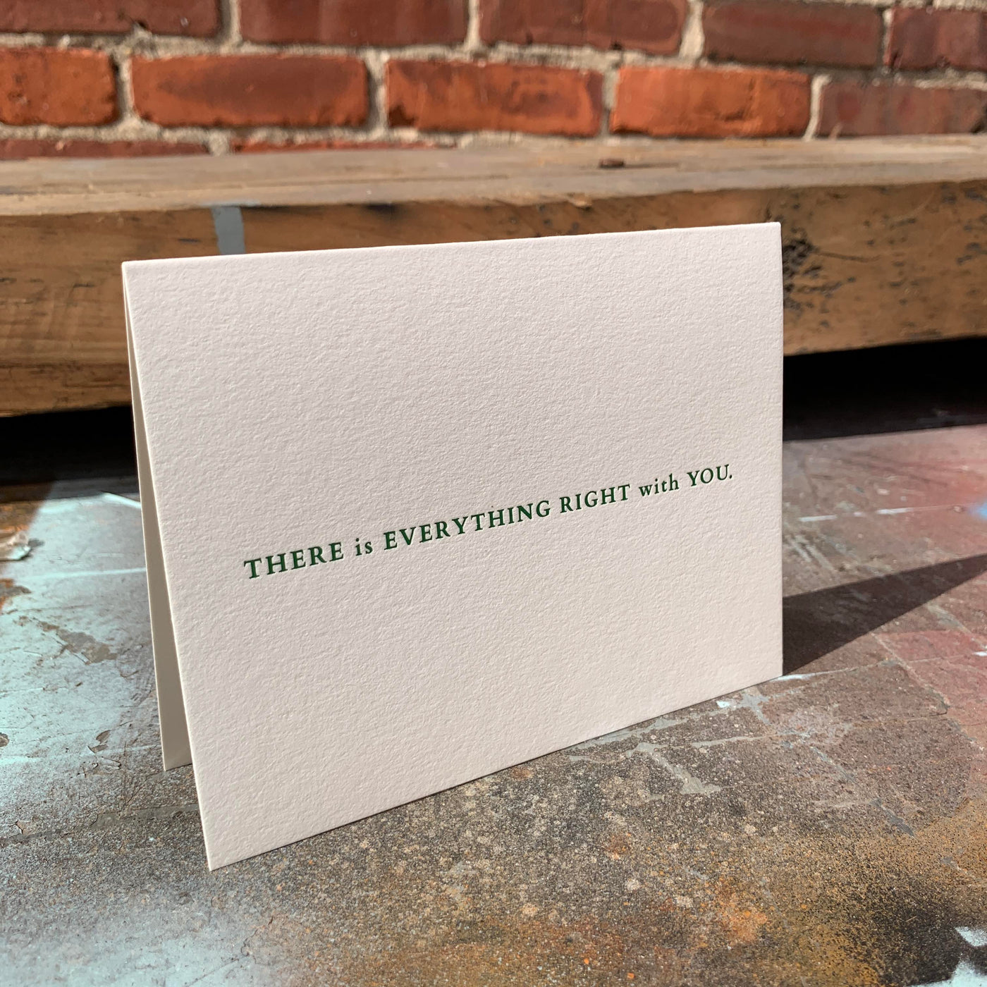 Greeting card on rusted table by beknown. There is everything right with you.