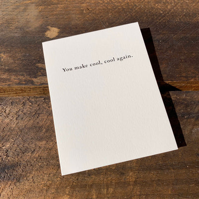 Greeting card on wood table by beknown. You make cool, cool again.